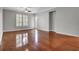 Spacious living room featuring hardwood floors, crown molding, and plenty of natural light from large windows at 125 Pier View St # 209, Charleston, SC 29492