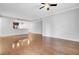 Open-concept living room with hardwood floors and a view into the kitchen area, great for entertaining at 125 Pier View St # 209, Charleston, SC 29492