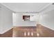 Large living room showcasing hardwood floors and an open view to the kitchen for a seamless living experience at 125 Pier View St # 209, Charleston, SC 29492
