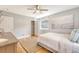 Bedroom with neutral tones, hardwood floors, closet, and an expansive window at 13 Charlestowne Rd, Charleston, SC 29407
