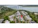 Community aerial view highlighting the residential buildings, parking, and nearby river with a bridge at 130 River Landing Dr # 9104, Charleston, SC 29492