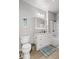 Well-lit bathroom features a vanity with white cabinets and a marble countertop, adjacent to the toilet at 130 River Landing Dr # 9104, Charleston, SC 29492