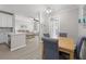 Inviting dining area featuring a wooden table with seating for four and a view into the bright living room at 130 River Landing Dr # 9104, Charleston, SC 29492