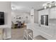 Open concept kitchen showcasing a quartz countertop island with seating and modern stainless steel appliances at 130 River Landing Dr # 9104, Charleston, SC 29492