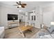 Comfortable living room and modern kitchen with a ceiling fan and hardwood floors at 130 River Landing Dr # 9104, Charleston, SC 29492