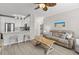 Comfortable living room with a view of the kitchen, with a sofa and stylish accents at 130 River Landing Dr # 9104, Charleston, SC 29492