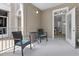 Charming patio with a table and two chairs, perfect for relaxing outdoors and indoor access through open doors at 130 River Landing Dr # 9104, Charleston, SC 29492