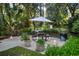 Community outdoor grilling and picnic area surrounded by lush landscaping at 1300 Park West Blvd # 519, Mount Pleasant, SC 29466