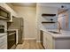 A well-equipped kitchen featuring stainless steel appliances and a white countertop island at 1300 Park West Blvd # 519, Mount Pleasant, SC 29466