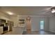 Modern kitchen featuring stainless steel appliances, white cabinets, and plank flooring at 1300 Park West Blvd # 519, Mount Pleasant, SC 29466