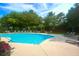 A full view of a large outdoor pool with green landscaping and lounge chairs at 1300 Park West Blvd # 519, Mount Pleasant, SC 29466