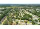 Overhead view of neighborhood with tree coverage and nearby highway at 1304 Pinyon Pine Dr, Ladson, SC 29456