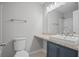 Bathroom features vanity with sink and navy blue cabinets, plus toilet and shower at 1304 Pinyon Pine Dr, Ladson, SC 29456