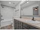 Bathroom featuring double sink vanity, and tiled shower and tub at 1304 Pinyon Pine Dr, Ladson, SC 29456