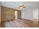 Bright bedroom featuring wood-look flooring, wood accent wall and neutral paint at 1304 Pinyon Pine Dr, Ladson, SC 29456