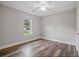 Bright, empty bedroom with hardwood floors, a ceiling fan and natural light at 1304 Pinyon Pine Dr, Ladson, SC 29456
