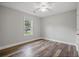 Bedroom with wood-look flooring, neutral color palette, and natural light at 1304 Pinyon Pine Dr, Ladson, SC 29456