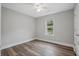 Empty bedroom featuring wood-look floors and a bright window at 1304 Pinyon Pine Dr, Ladson, SC 29456