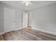 Empty bedroom with wood-look floors and open doorway at 1304 Pinyon Pine Dr, Ladson, SC 29456
