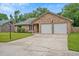 Attractive brick home with a two-car garage, lush lawn, and inviting curb appeal at 1304 Pinyon Pine Dr, Ladson, SC 29456