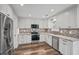 Modern kitchen featuring stainless steel appliances, granite countertops, and wood flooring at 1304 Pinyon Pine Dr, Ladson, SC 29456