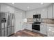 Recently renovated kitchen features granite countertops and stainless steel appliances at 1304 Pinyon Pine Dr, Ladson, SC 29456