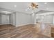 Bright living room features hardwood floors, neutral walls, and is open to kitchen at 1304 Pinyon Pine Dr, Ladson, SC 29456