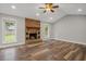 Spacious living room with vaulted ceilings, hardwood floors, and cozy stone fireplace at 1304 Pinyon Pine Dr, Ladson, SC 29456