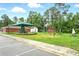 Exterior of the community playground with a green sunshade, various play equipment, and seating for guardians at 1304 Pinyon Pine Dr, Ladson, SC 29456