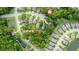 Aerial view of a neighborhood showcasing lush greenery, nearby parks, and houses surrounded by mature trees at 1309 Belgian Draft Dr, Mount Pleasant, SC 29466