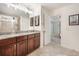 Bright bathroom with double vanity, granite counters, and glass enclosed shower at 1309 Belgian Draft Dr, Mount Pleasant, SC 29466