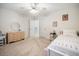 Bedroom with neutral carpet, white bedding, dresser, and access to hallway at 1309 Belgian Draft Dr, Mount Pleasant, SC 29466
