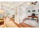 Bright home interior showcases hardwood floors, an office with french doors, and an archway to a living space at 1309 Belgian Draft Dr, Mount Pleasant, SC 29466