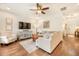 Open-concept living room with hardwood floors, a ceiling fan, and comfortable seating options at 1309 Belgian Draft Dr, Mount Pleasant, SC 29466
