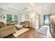 Bright and airy living room with hardwood floors, a vaulted ceiling, stylish furnishings, and access to the front door at 1309 Belgian Draft Dr, Mount Pleasant, SC 29466