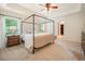 Spacious bedroom with four poster bed, ceiling fan, and windows for natural light at 1309 Belgian Draft Dr, Mount Pleasant, SC 29466