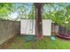 Secluded backyard space featuring an ornamental tree, a swing, and a trampoline at 1328 Lark Ln, Hanahan, SC 29410