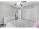 Bedroom with plush carpet, ceiling fan and closet with white doors at 1328 Lark Ln, Hanahan, SC 29410