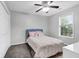 Comfortable bedroom features a ceiling fan and bright natural light from window at 1328 Lark Ln, Hanahan, SC 29410