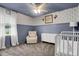 Charming Bedroom features blue accent wall, a chair, and white baby crib at 1328 Lark Ln, Hanahan, SC 29410