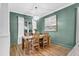 Charming dining space featuring stylish light fixtures and wooden table at 1328 Lark Ln, Hanahan, SC 29410