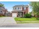 Charming brick home with well-maintained lawn, attached garage and inviting entryway at 1328 Lark Ln, Hanahan, SC 29410