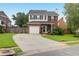 Attractive two-story brick home with a paved driveway and manicured front lawn at 1328 Lark Ln, Hanahan, SC 29410