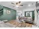 Inviting living room featuring stylish couches, a glass coffee table, and an open floor plan at 1328 Lark Ln, Hanahan, SC 29410