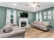 Cozy living room showcasing a fireplace, modern decor, and lots of natural light at 1328 Lark Ln, Hanahan, SC 29410