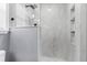 Bathroom featuring a modern shower with marble-style tiling and sleek fixtures at 1328 Lark Ln, Hanahan, SC 29410
