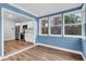 Bright sun room with ample windows, hardwood floors, and a view of the backyard at 1328 Lark Ln, Hanahan, SC 29410