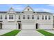 Charming townhomes with attached garages and manicured lawns at 138 Brown Swiss Cir, Summerville, SC 29483