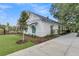 Charming exterior view of the community pool house with modern architecture, lush landscaping, and a welcoming walkway at 138 Brown Swiss Cir, Summerville, SC 29483