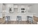 Kitchen with white cabinets, stainless appliances, and breakfast bar at 138 Brown Swiss Cir, Summerville, SC 29483